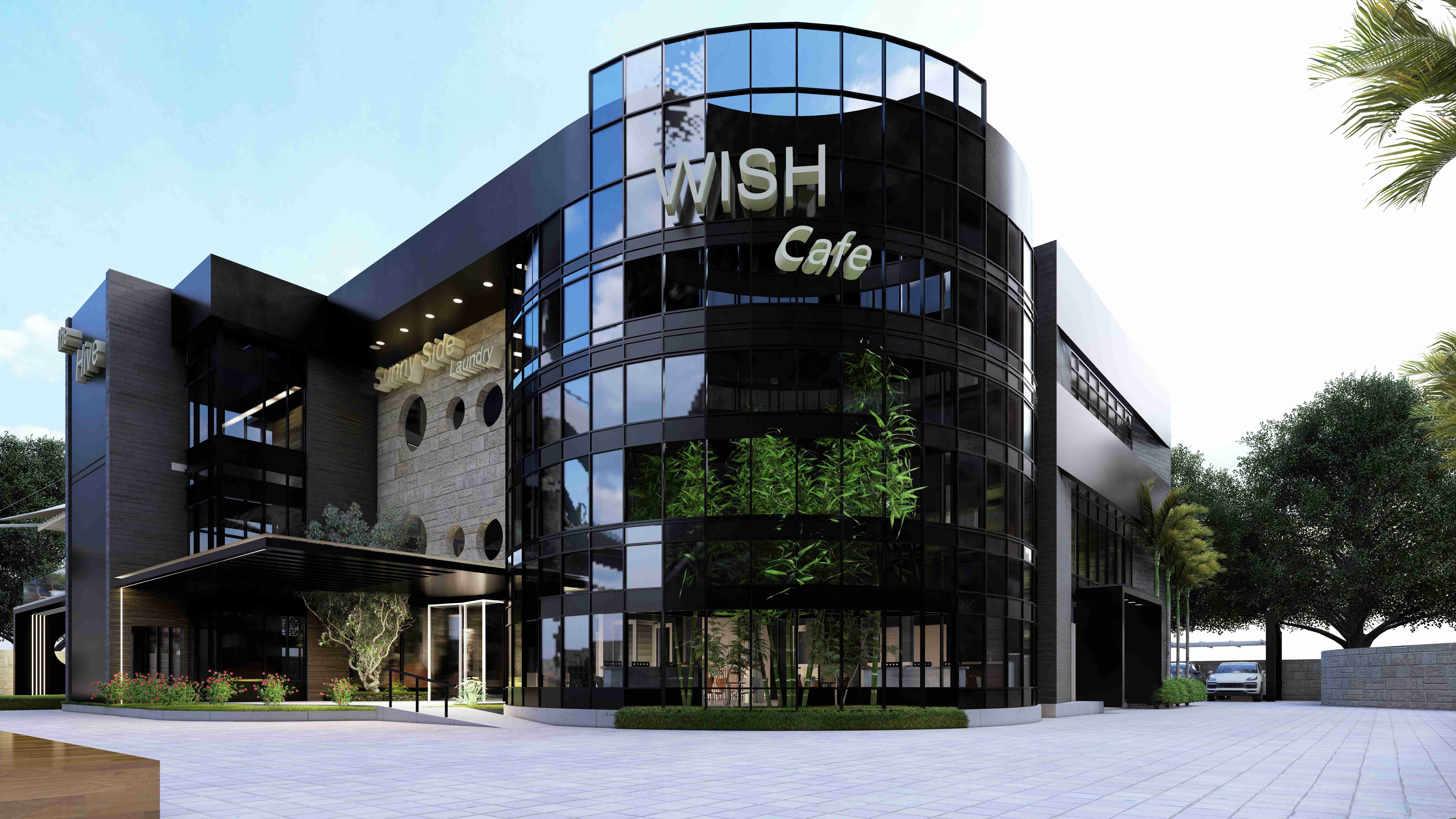 The Sunny Side Eco Hub building in Lagos, a curved glass and stone landmark at golden hour